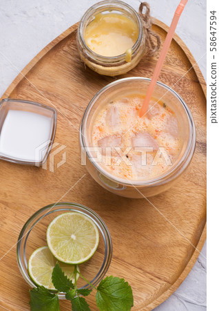 fresh vegetarian fruit smoothie on wooden tray fresh vegetarian fruit smoothie on wooden tray 58647594
