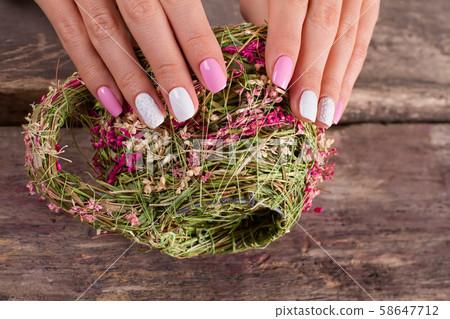 Beautiful gentle spring manicure closeup. Beautiful gentle spring manicure closeup. 58647712