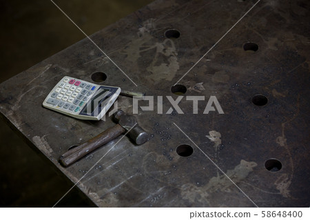 Calculator and hammer Calculator and hammer 58648400