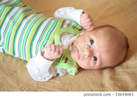 Lying on the bed sheet baby at home Lying on the bed sheet baby at home 58649063