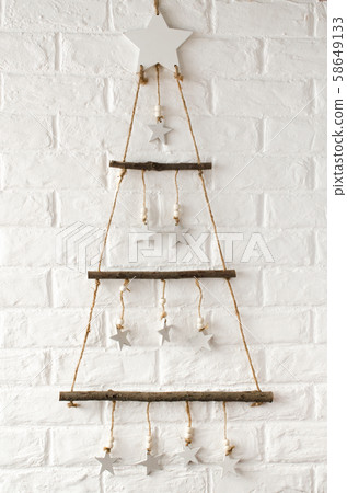 Wooden stylish Christmas tree in scandinavian style  58649133