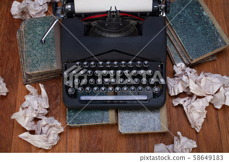 Old retro vintage typewriter with paper on wooden Old retro vintage typewriter with paper on wooden 58649183