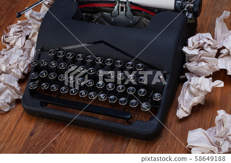 Old retro vintage typewriter with paper on wooden Old retro vintage typewriter with paper on wooden 58649188
