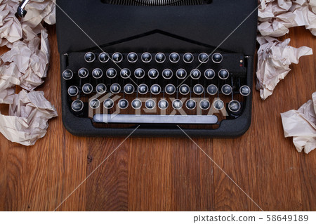 Old retro vintage typewriter with paper on wooden Old retro vintage typewriter with paper on wooden 58649189
