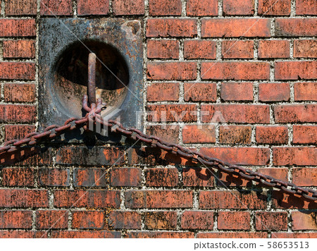 Red brick wall and mooring ring (Osaka Kuma Gate) 58653513