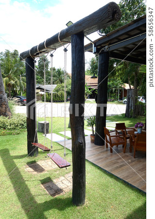 Empty swing on children playground 58656347