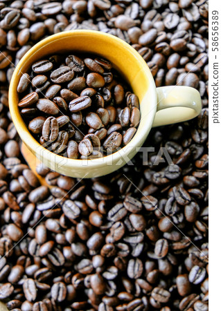 Cup of coffee with coffee beans 58656389