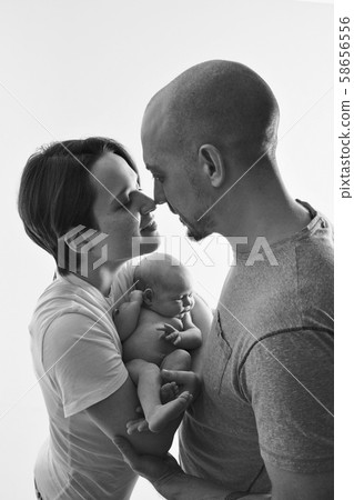 family photo on a white background: parents spend time with their children. mom and dad hug the baby. the concept of childhood, fatherhood, motherhood, IVF 58656556