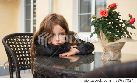 Schoolchild on terrace of summer cafe Schoolchild on terrace of summer cafe 58657824