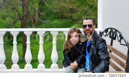 Dad and daughter walk around the city Dad and daughter walk around the city 58657883