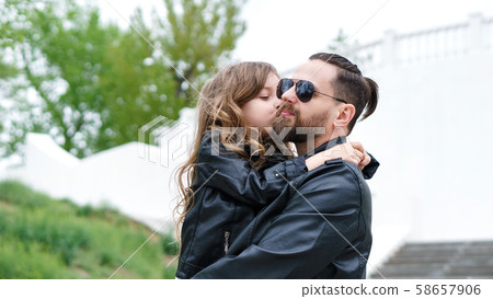 Dad and daughter walk around the city Dad and daughter walk around the city 58657906