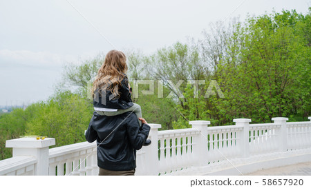 Dad and daughter walk around the city Dad and daughter walk around the city 58657920