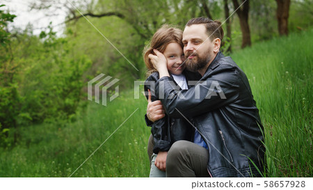 Dad and daughter spend time together in park 58657928