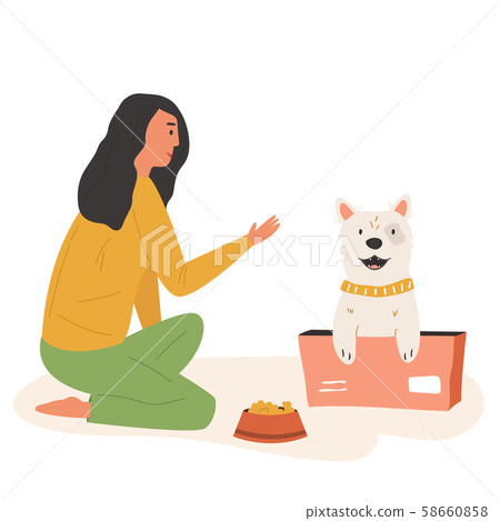 Young cute volunteer girl feeding street dog Young cute volunteer girl feeding street dog 58660858