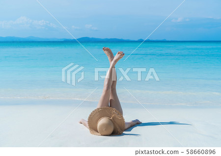 Happy Asian woman, a sexy Thai lady, relaxing and Happy Asian woman, a sexy Thai lady, relaxing and 58660896