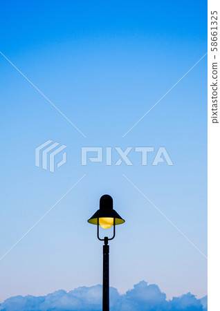 Vintage retro light pole with blue sky background 58661325