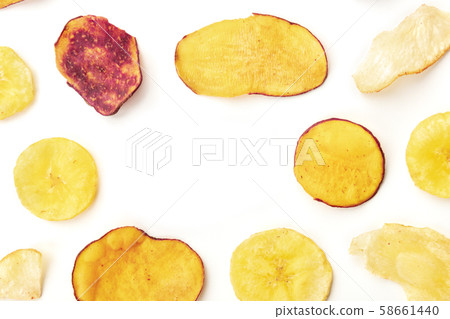 Dried fruit and vegetable chips, healthy vegan snack, top shot on a white background, forming a 58661440
