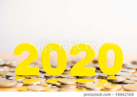Wood block 2020 on Coin stack. Wood block 2020 on Coin stack. 58662508