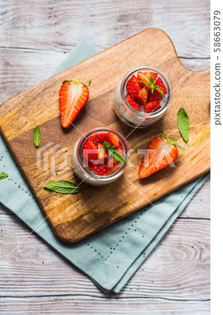 Yogurt and granola with strawberries. Breakfast 58663079