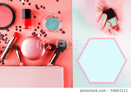 Make up items on pink and mint green. Flat lay Make up items on pink and mint green. Flat lay 58663121