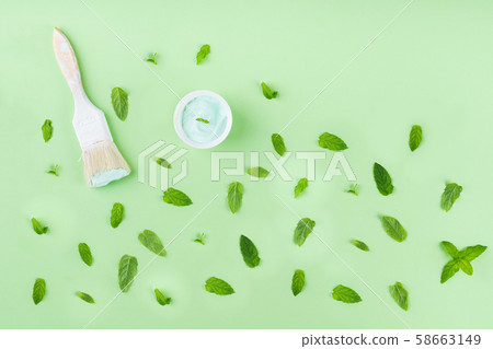 Paint brush on green mint background with pattern 58663149