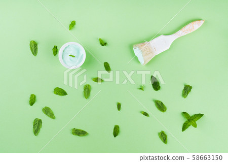 Paint brush on green mint background with pattern Paint brush on green mint background with pattern 58663150