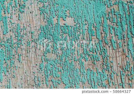 Old and peeling paint Over time, the green paint peeled off from the old boards and the wood texture 58664327