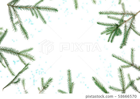 Christmas frame of fir tree branches with blue snowflakes on white background. Flat lay, top view. 58666570