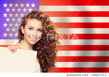 Happy american girl with white paper against flag Happy american girl with white paper against flag 58667253