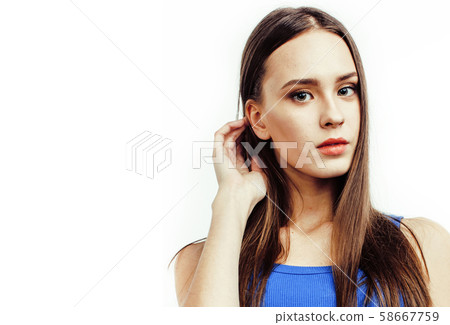 young pretty teenage hipster girl posing emotional happy smiling on white background, lifestyle 58667759