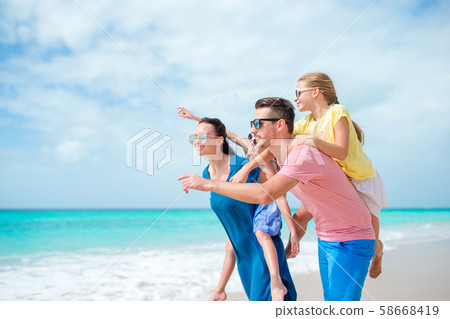 Happy family on the beach during summer vacation 58668419
