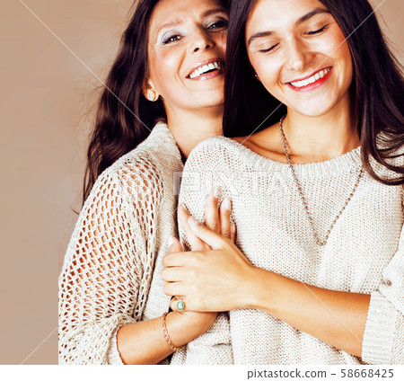 cute pretty teen daughter with mature mother hugging, fashion style brunette makeup close up tann s cute pretty teen daughter with mature mother hugging, fashion style brunette makeup close up tann s 58668425