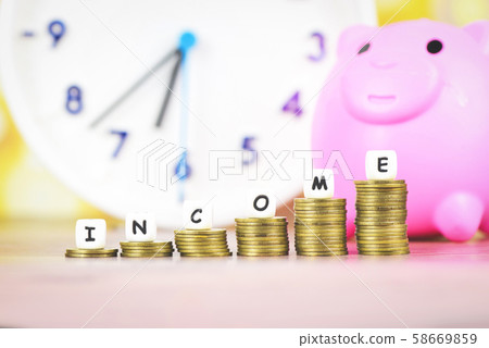 income growth money coins on table - Pile of 58669859