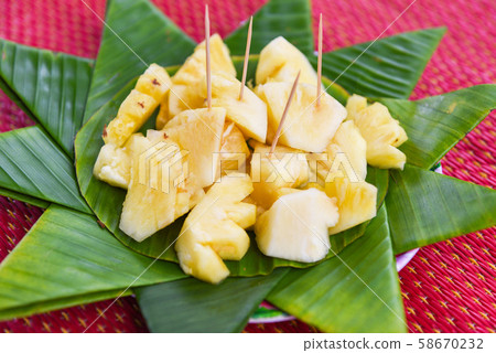 pineapple slice on banana leaf background fruit 58670232