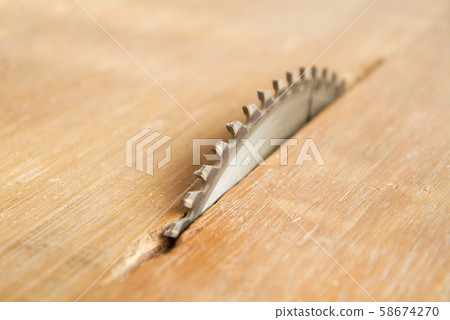 Metal circular saw blade in carpenter's shop 58674270