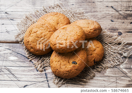 Natural oatmeal cookies on wooden background. Rustic style. Copy space Natural oatmeal cookies on wooden background. Rustic style. Copy space 58674665