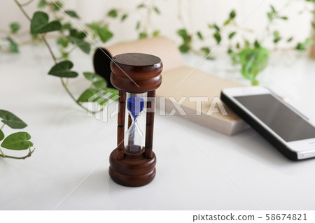 Smartphone and hourglass 58674821