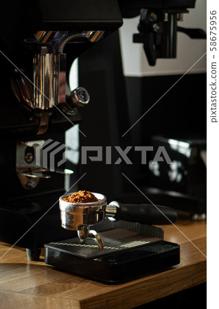 freshly ground coffee in a portafilter freshly ground coffee in a portafilter 58675956