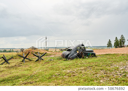 Old ruined USSR car on the battlefield. 58676892