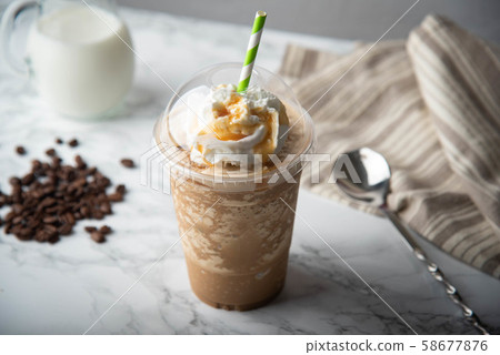 caramel frappuccino with wipped cream on marble caramel frappuccino with wipped cream on marble 58677876