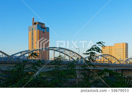 Gunma Bridge over Tone River and Gunma Prefectural Office at dusk Gunma Bridge over Tone River and Gunma Prefectural Office at dusk 58679053