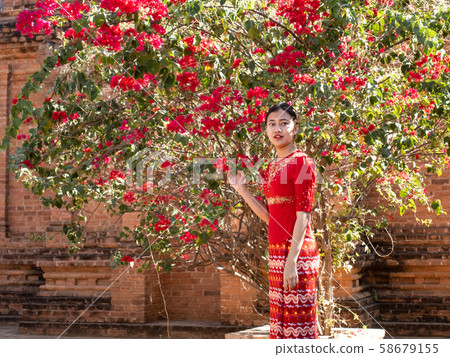 Asian Beauty Myanmar Young Woman Red Flower and Red Dress Woman 58679155