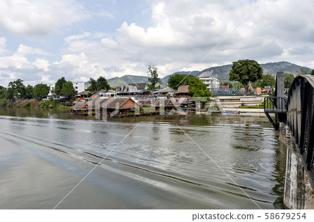 Thailand's Kwai River and the iron bridge over it 58679254