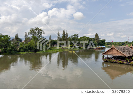 Thailand's Kwai River and the iron bridge over it 58679260