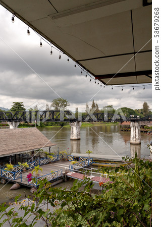 Thailand's Kwai River and the iron bridge over it 58679268