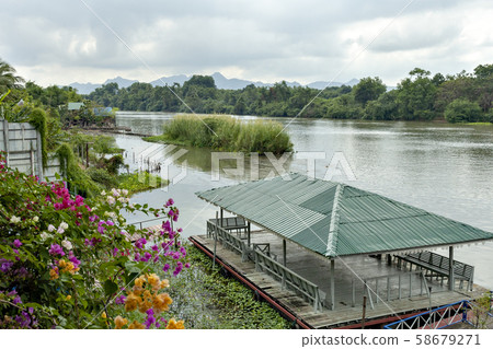 Thailand's Kwai River and the iron bridge over it 58679271