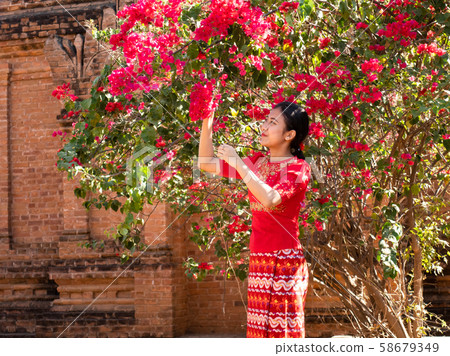 Asian Beauty Myanmar Young Woman Red Flower and Red Dress Woman Asian Beauty Myanmar Young Woman Red Flower and Red Dress Woman 58679349