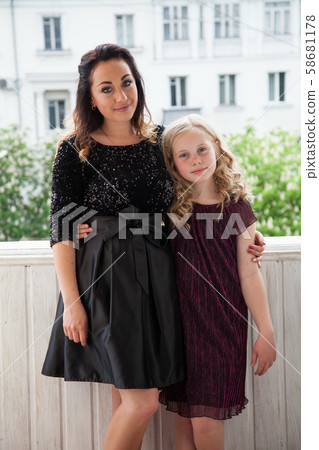Portrait of a beautiful mom and daughter of 10 years Portrait of a beautiful mom and daughter of 10 years 58681178