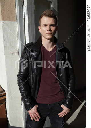 portrait of a fashionable man in a leather jacket portrait of a fashionable man in a leather jacket 58682073