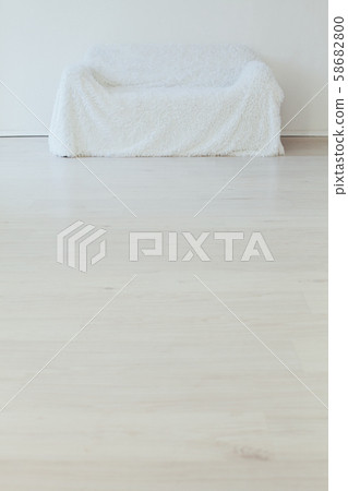 white sofa in the interior of an empty white room 58682800